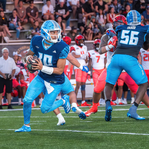 quarterback fading back to pass