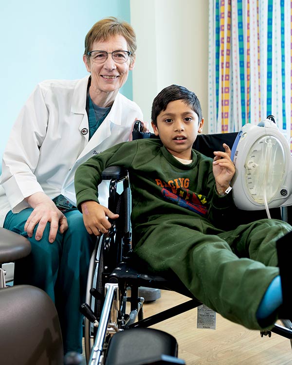 female provider with male patient in wheelchair
