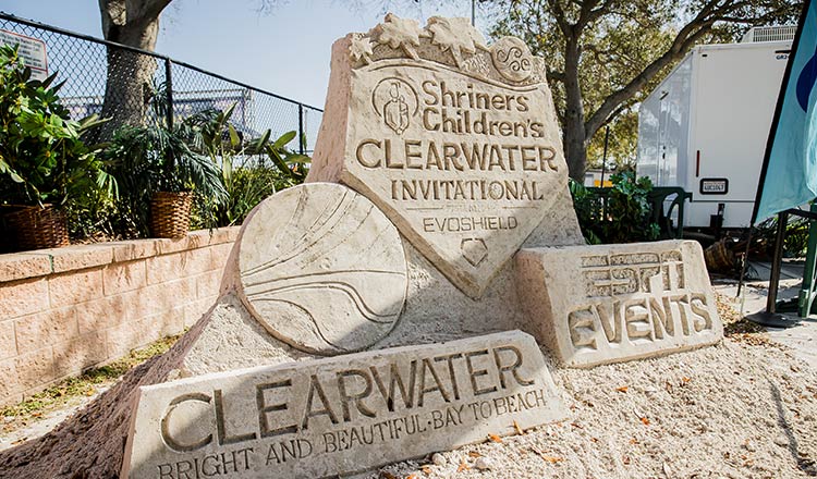 sand sculpture - Shriners Children's Clearwater Invitational Evoshield logo, ESPN Events logo, Clearwater - Bright and Beautiful Bay to Beach